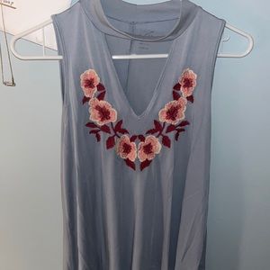 Light blue shirt with embroidered pink and red flowers